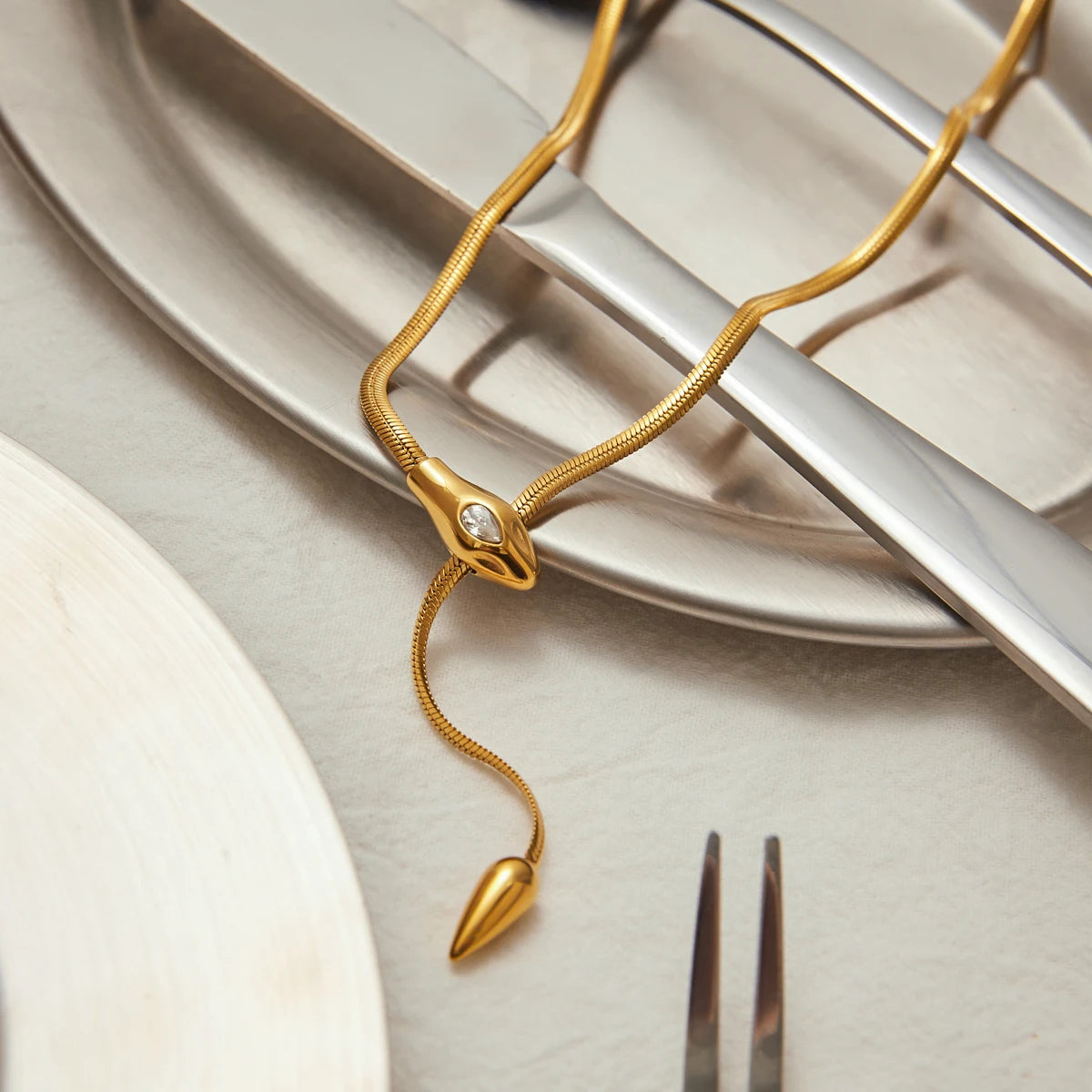 Gold bracelet with a unique design on a neutral background
