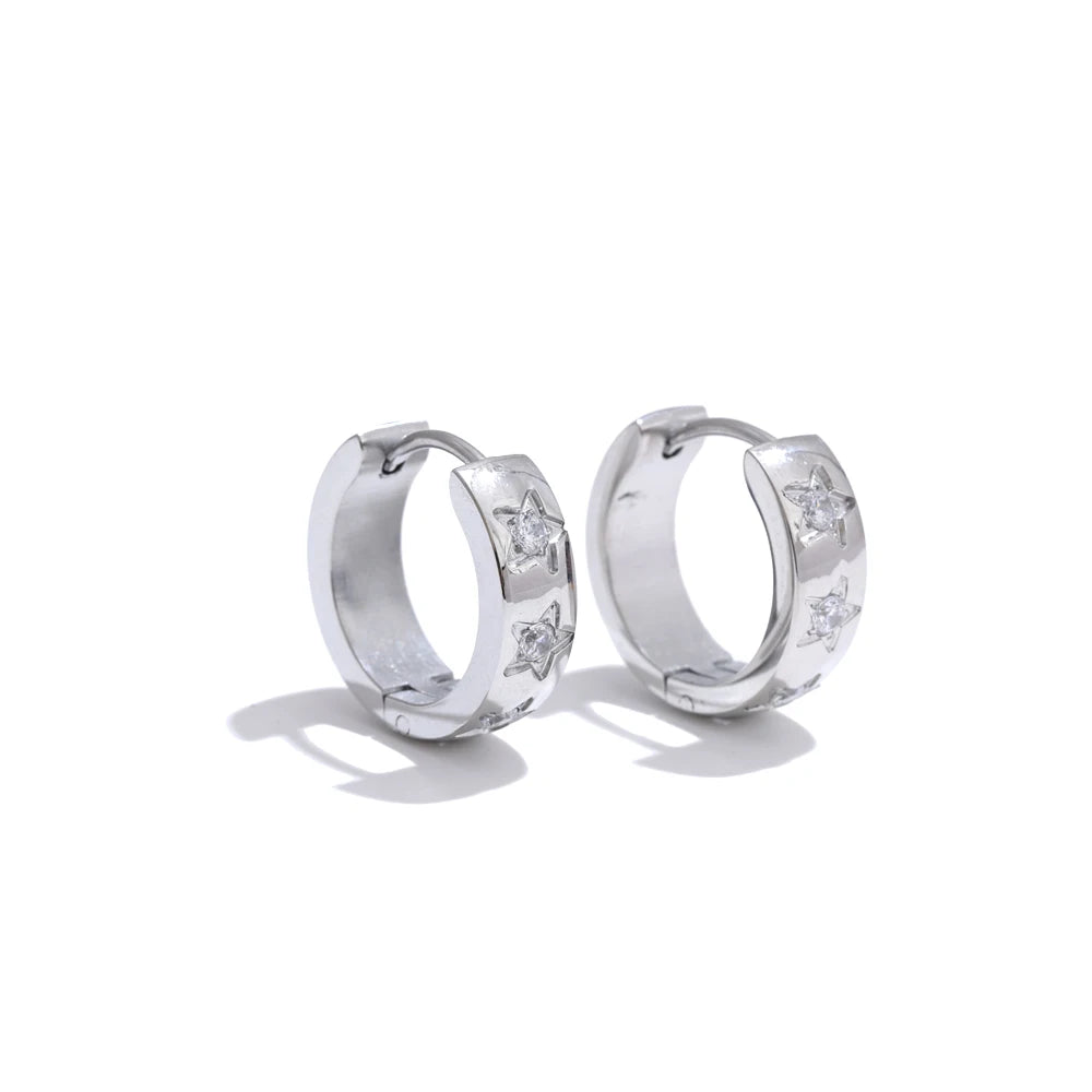 Silver hoop earrings with embedded stones on a white background